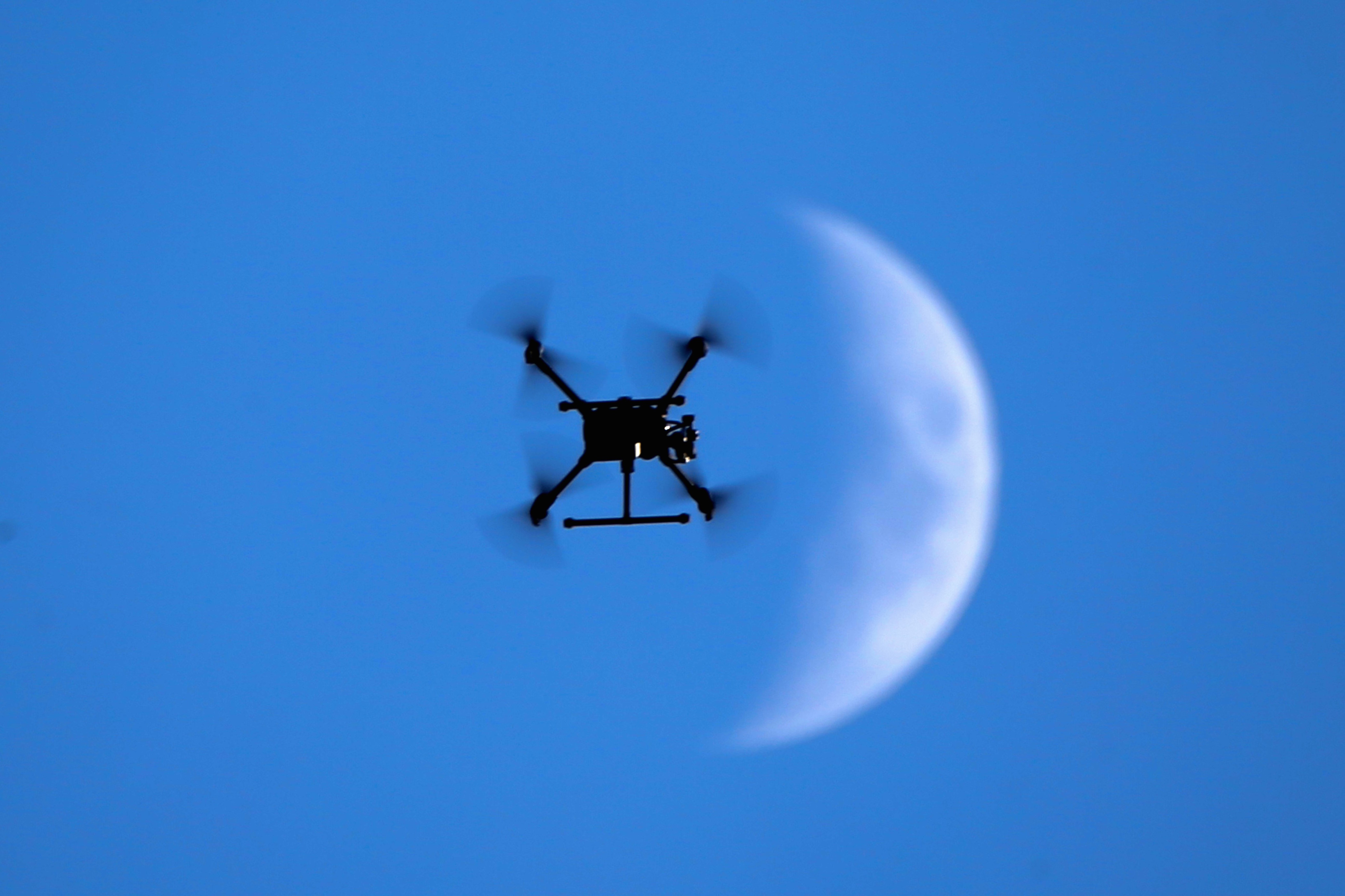 A border patrol drone flies past the moon over Turkey-Iraq border in Semdinli district of Hakkari,Turkey on May 21, 2018. (Photo by Ozkan Bilgin/Anadolu Agency/Getty Images)