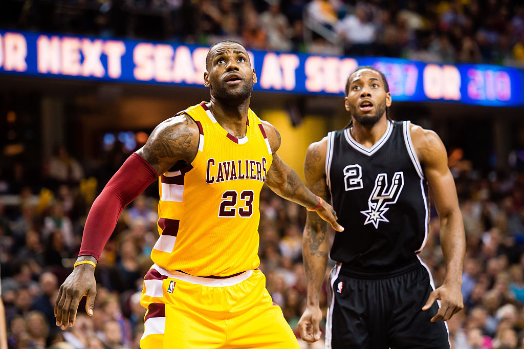 LeBron James #23 of the Cleveland Cavaliers and Kawhi Leonard #2 of the San Antonio Spurs wait for a rebound during the second half at Quicken Loans Arena on January 30, 2016 in Cleveland, Ohio. The Cavaliers defeated the Spurs 117-103. (Jason Miller/Getty Images)