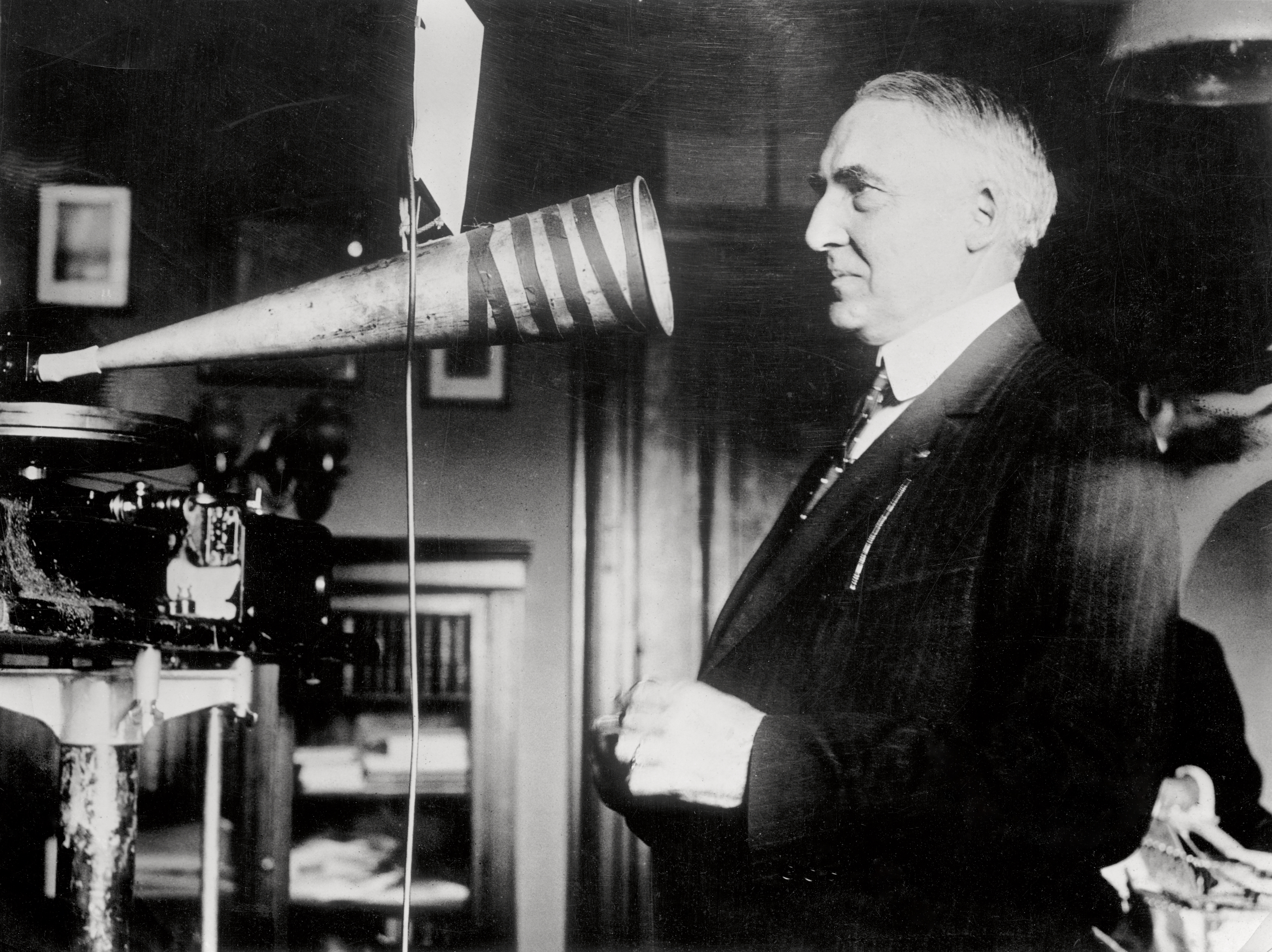 Senator Warren Harding, campaigning in 1920, making a phonograph record of a speech in his office. (Getty)