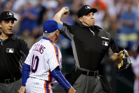 Home plate umpire Adam Hamari throws out manager Terry Collins #10 of the New York Mets after Collins argued the call of starting pitcher Noah Syndergaard getting ejected in the third inning at Citi Field on May 28, 2016 in the Flushing neighborhood of the Queens borough of New York City.  (Photo by Elsa/Getty Images)