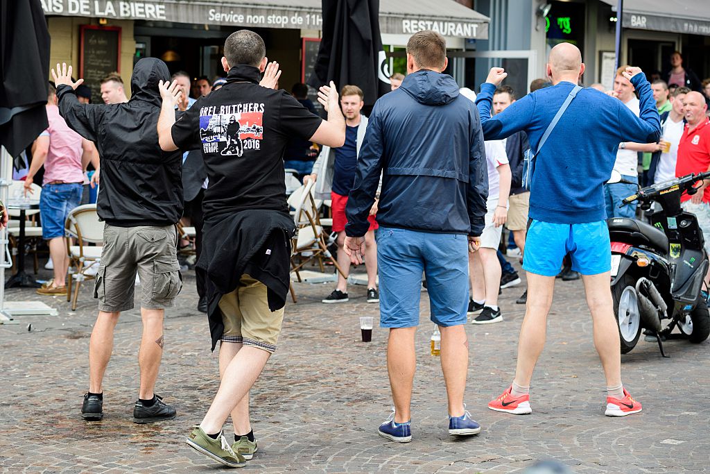 A small group of Russian men provoke a group of England supporters in the centre of Lille, on June 14, 2016, three days after Russia and England football fans clashed in the southern French city of Marseille during the Russia vs England, group B, Euro 2016 match.  / AFP / LEON NEAL  (Photo credit should read LEON NEAL/AFP/Getty Images)