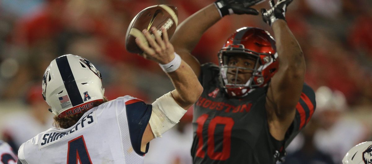  Bryant Shirreffs #4 of the Connecticut Huskies has is pass attempt knocked down by Ed Oliver #10 of the Houston Cougars in the fourth quarter on September 29, 2016 in Houston, Texas.  (Photo by Bob Levey/Getty Images)