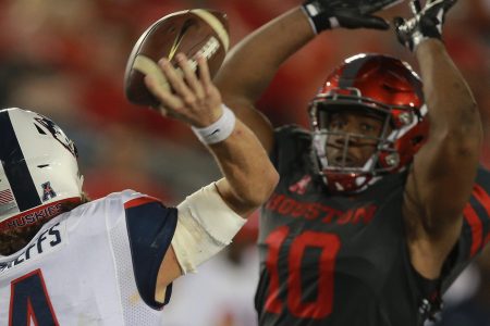  Bryant Shirreffs #4 of the Connecticut Huskies has is pass attempt knocked down by Ed Oliver #10 of the Houston Cougars in the fourth quarter on September 29, 2016 in Houston, Texas.  (Photo by Bob Levey/Getty Images)