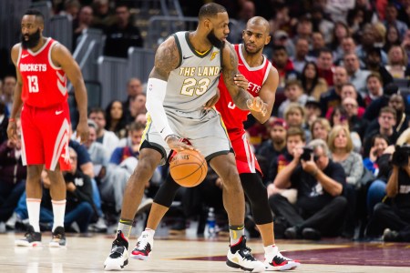 LeBron James #23 of the Cleveland Cavaliers tries to drive around Chris Paul #3 of the Houston Rockets during the first half at Quicken Loans Arena on February 3, 2018 in Cleveland, Ohio. (Photo by Jason Miller/Getty Images)
