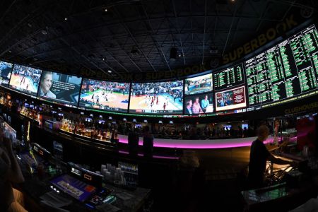 Guests attend a viewing party for the NCAA Men's College Basketball Tournament inside the 25,000-square-foot Race & Sports SuperBook at the Westgate Las Vegas Resort & Casino which features 4,488-square-feet of HD video screens on March 15, 2018 in Las Vegas, Nevada.  (Photo by Ethan Miller/Getty Images)