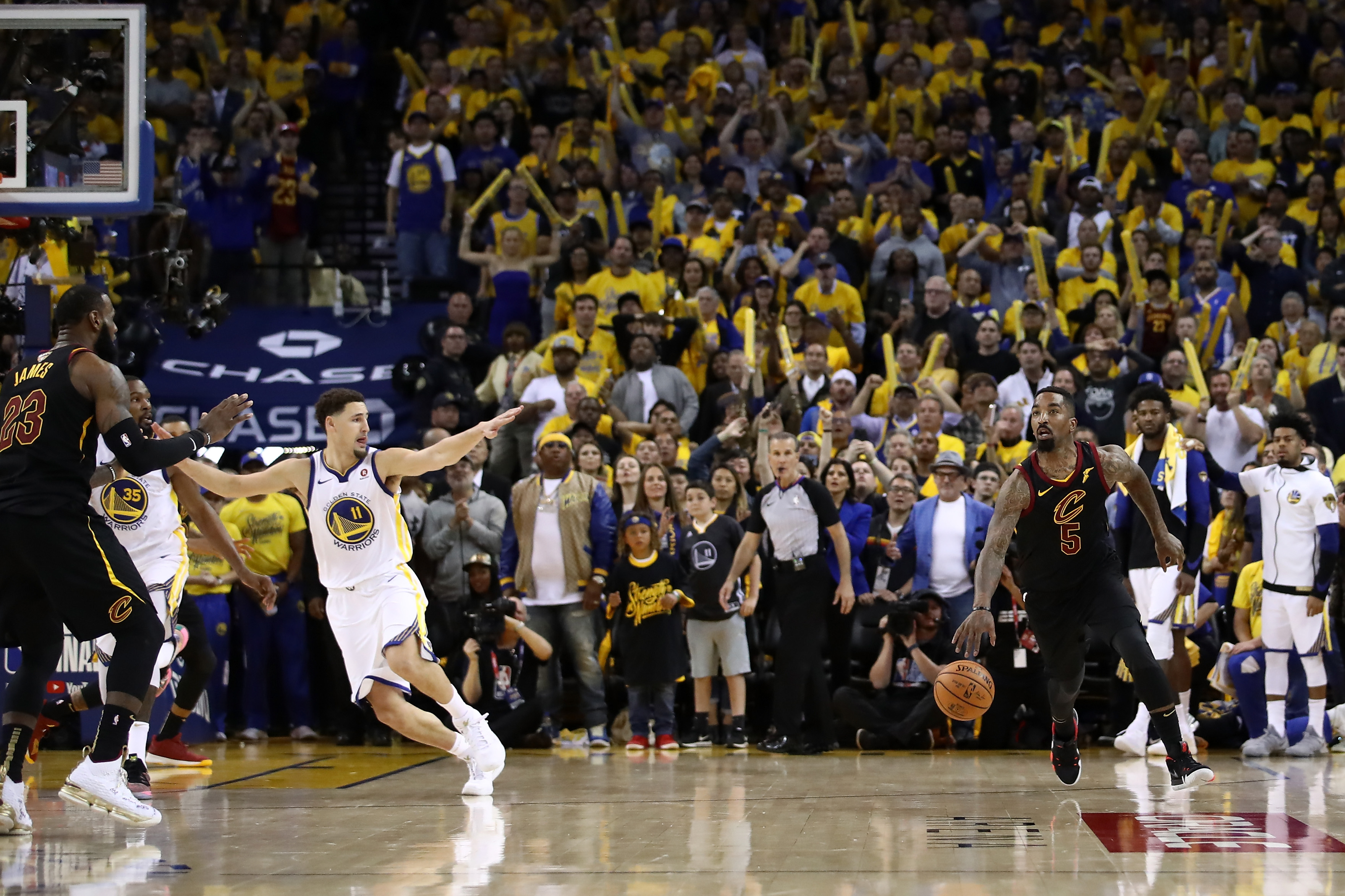 JR Smith #5 of the Cleveland Cavaliers dribbles in the closing seconds of regulation as LeBron James #23 attempts direct the offense against the Golden State Warriors in Game 1 of the 2018 NBA Finals at ORACLE Arena on May 31, 2018 in Oakland, California. (Photo by Ezra Shaw/Getty Images)
