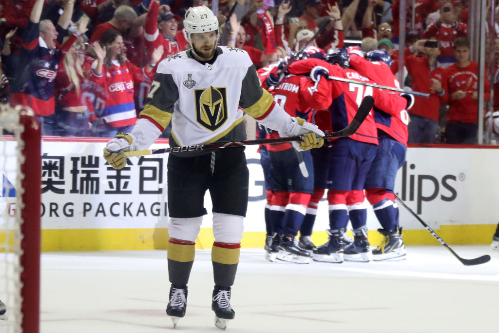 Brett Connolly #10 of the Washington Capitals is congratulated by his teammates after scoring a third-periof goal as Shea Theodore #27 of the Vegas Golden Knights reacts in Game Four of the 2018 NHL Stanley Cup Final at Capital One Arena on June 4, 2018 in Washington, DC.  (Photo by Bruce Bennett/Getty Images)