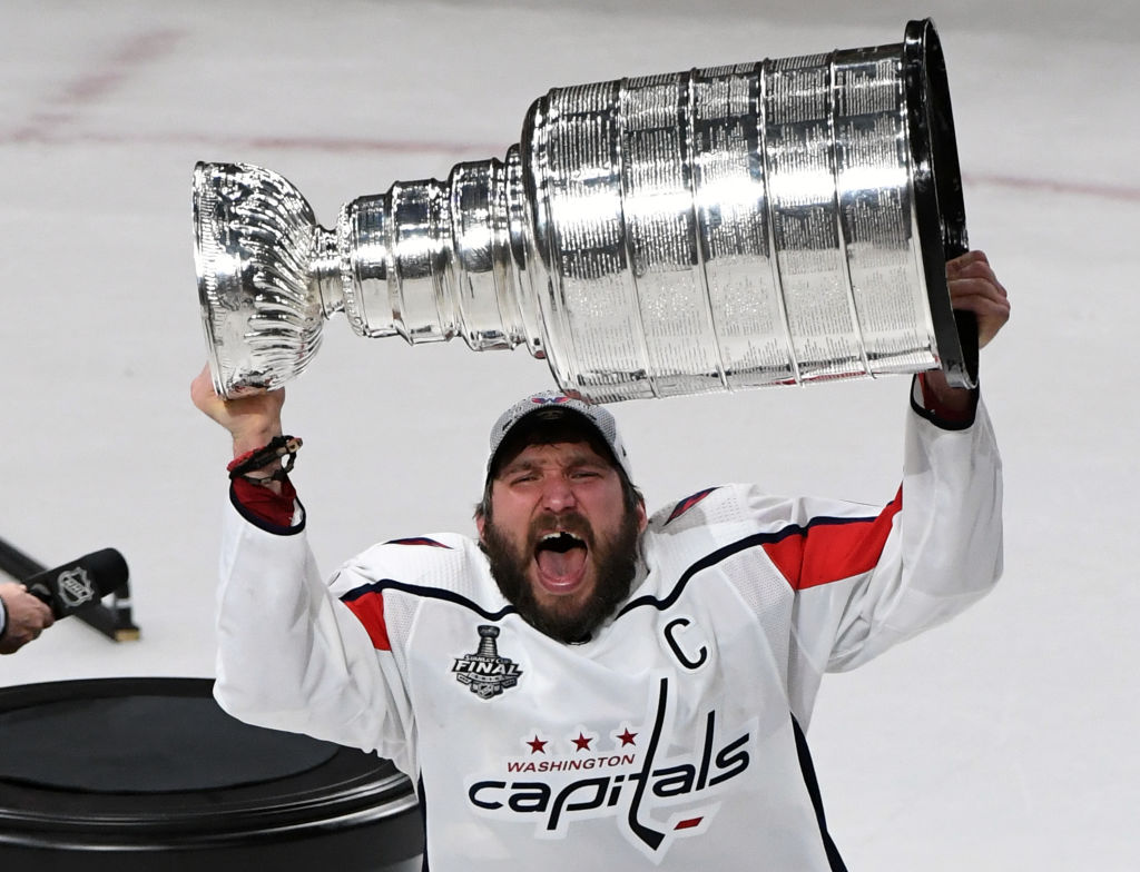 Alex Ovechkin #8 of the Washington Capitals hoists the Stanley Cup after the team's 4-3 win over the Vegas Golden Knights in Game Five of the 2018 NHL Stanley Cup Final at T-Mobile Arena on June 7, 2018 in Las Vegas, Nevada.  (Photo by Ethan Miller/Getty Images)