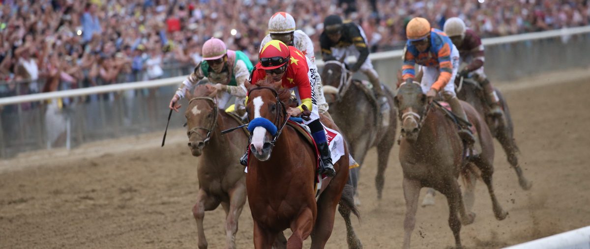 Justify with Mike Smith up wins the Belmont Stakes and Triple Crown for trainer Bob Baffert at Belmont Park Racetrack on June 09, 2018 in Elmont, New York (Photo by Horsephotos/Getty Images)