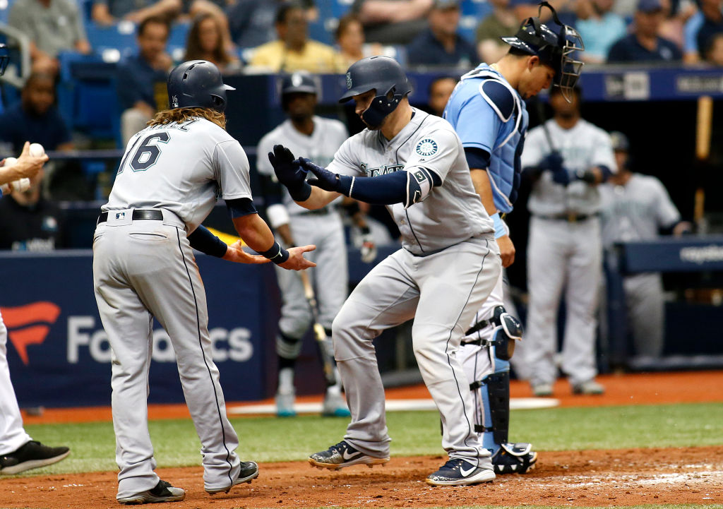 Mike Zunino #3 of the Seattle Mariners celebrates with teammate Ben Gamel in front of catcher Wilson Ramos #40 of the Tampa Bay Rays after scoring off of his two-run home run during the sixth inning of a game on June 10, 2018 at Tropicana Field in St. Petersburg, Florida.  (Photo by Brian Blanco/Getty Images) 