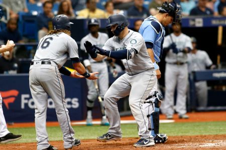 Mike Zunino #3 of the Seattle Mariners celebrates with teammate Ben Gamel in front of catcher Wilson Ramos #40 of the Tampa Bay Rays after scoring off of his two-run home run during the sixth inning of a game on June 10, 2018 at Tropicana Field in St. Petersburg, Florida.  (Photo by Brian Blanco/Getty Images) 