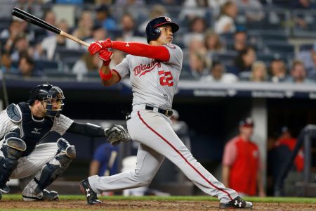 Juan Soto #22 of the Washington Nationals follows through on his seventh inning home run against the New York Yankees at Yankee Stadium on June 13, 2018 in the Bronx borough of New York City. The Nationals defeated the Yankees 5-4.  (Photo by Jim McIsaac/Getty Images)