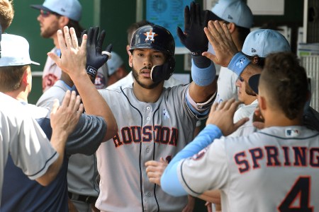 Houston Astros shortstop Carlos Correa (1) is congratulated in the dugout after tying the game in the eighth inning with a solo home run during a Major League Baseball game between the Houston Astros and the Kansas City Royals on June 17, 2018, at Kauffman Stadium, Kansas City, MO.  Houston won, 7-4. (Photo by Keith Gillett/Icon Sportswire via Getty Images)