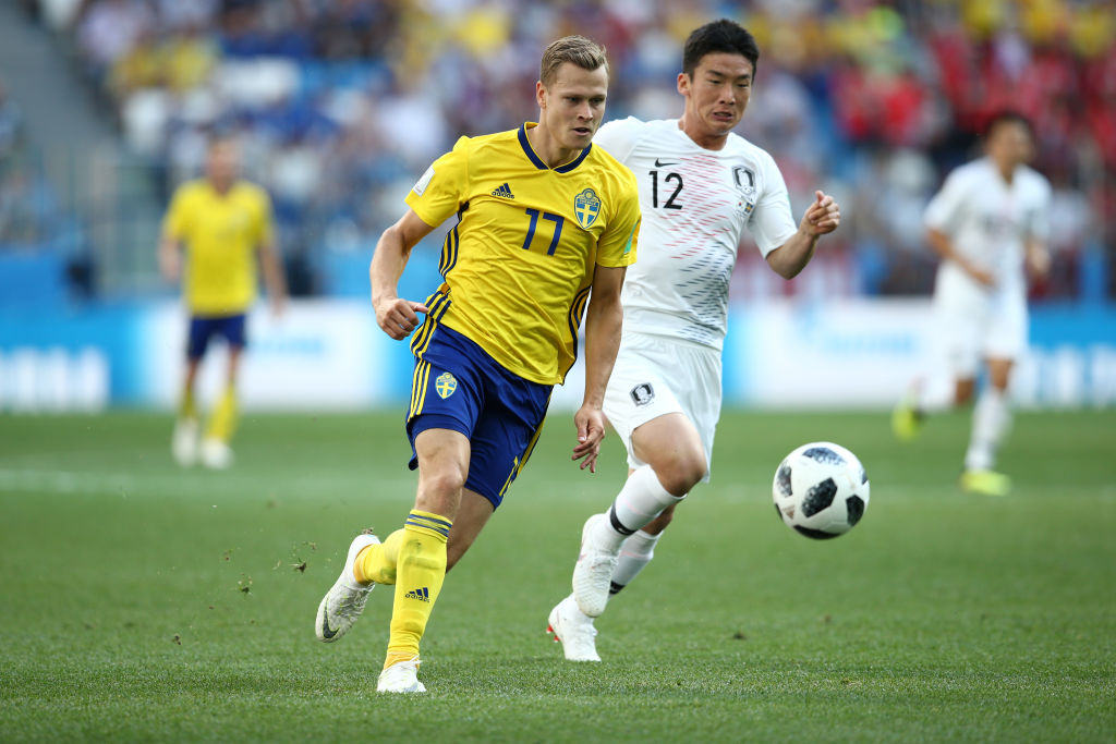Viktor Claesson of Sweden and Kim Min-Woo of Korea Republic battle for the ball during the 2018 FIFA World Cup Russia group F match between Sweden and Korea Republic at Nizhniy Novgorod Stadium on June 18, 2018 in Nizhniy Novgorod, Russia.  (Photo by Jan Kruger/Getty Images)