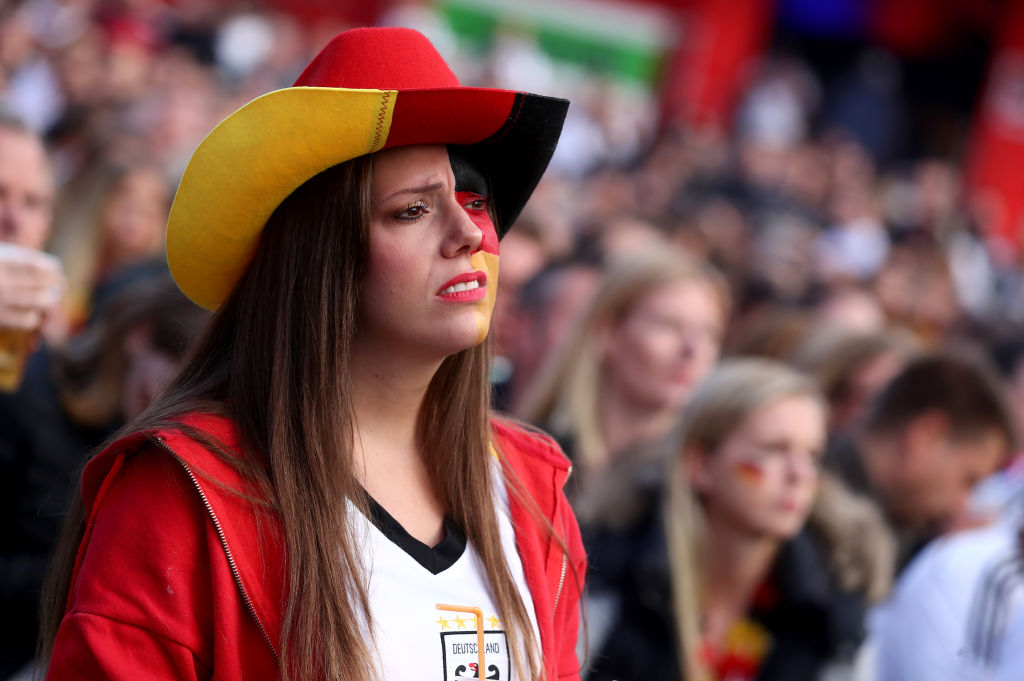 A German fan as she watches Germany national team play in their 2018 FIFA World Cup Russia match against Sweden at 11 Freunde - Die Fussball Arena on June 23, 2018 in Essen, Germany. (Photo by Christof Koepsel/Bongarts/Getty Images)