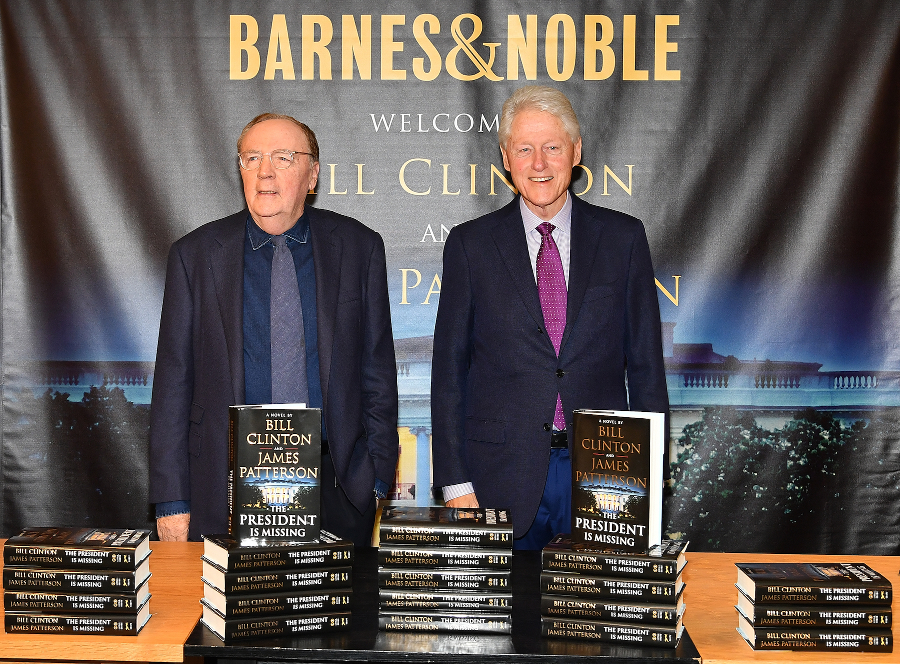 James Patterson (L) and Bill Clinton sign copies of their new book "The President Is Missing" at Barnes & Noble, 5th Avenue on June 5, 2018 in New York City.  (Photo by Slaven Vlasic/Getty Images)