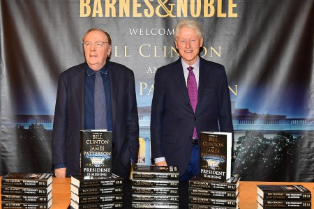 James Patterson (L) and Bill Clinton sign copies of their new book "The President Is Missing" at Barnes & Noble, 5th Avenue on June 5, 2018 in New York City.  (Photo by Slaven Vlasic/Getty Images)