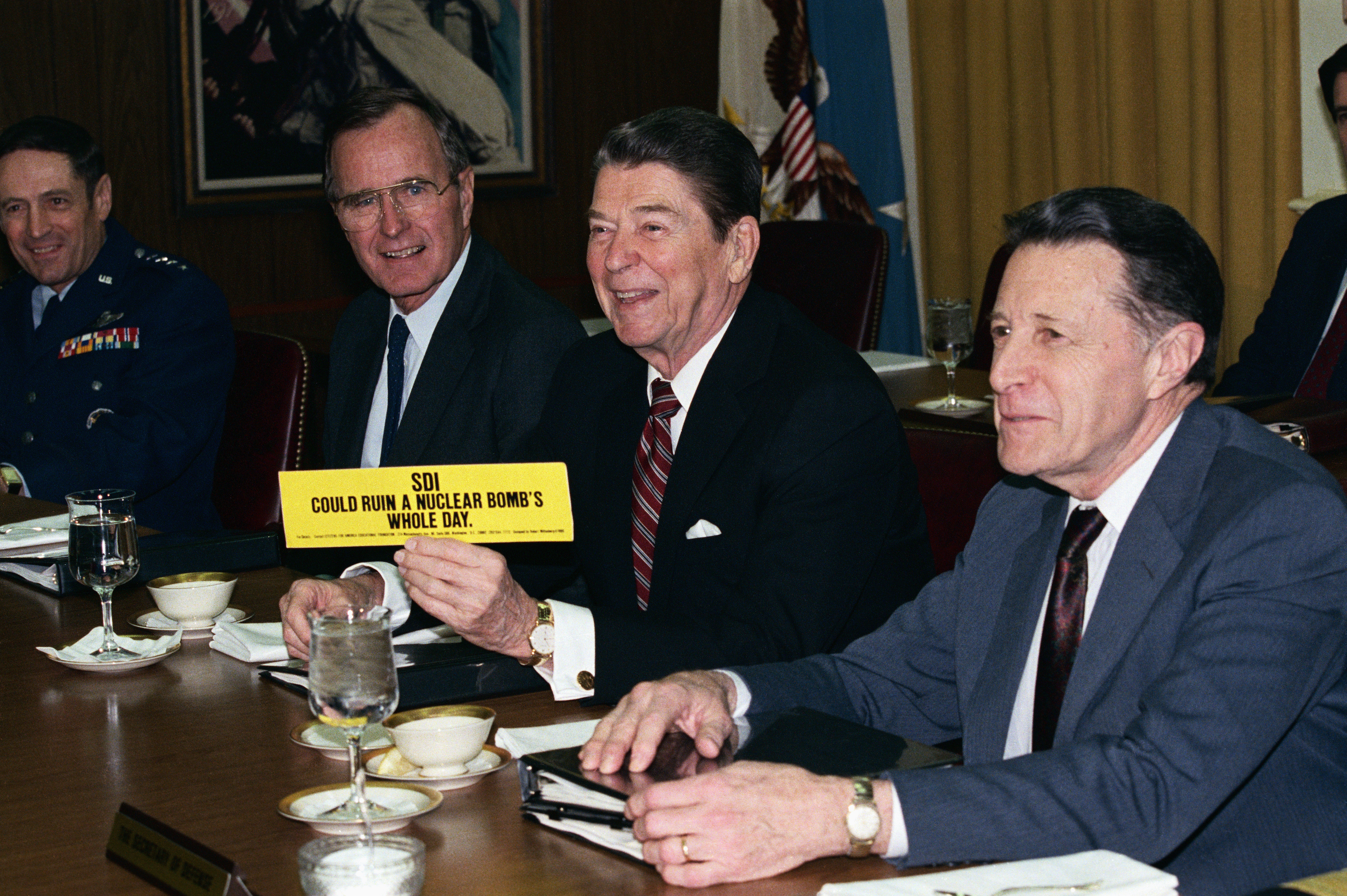 President Ronald Reagan showing support for the Strategic Defense Initiative, nicknamed Star Wars. The bumper sticker reads SDI could ruin a nuclear bomb's whole day. (Getty)