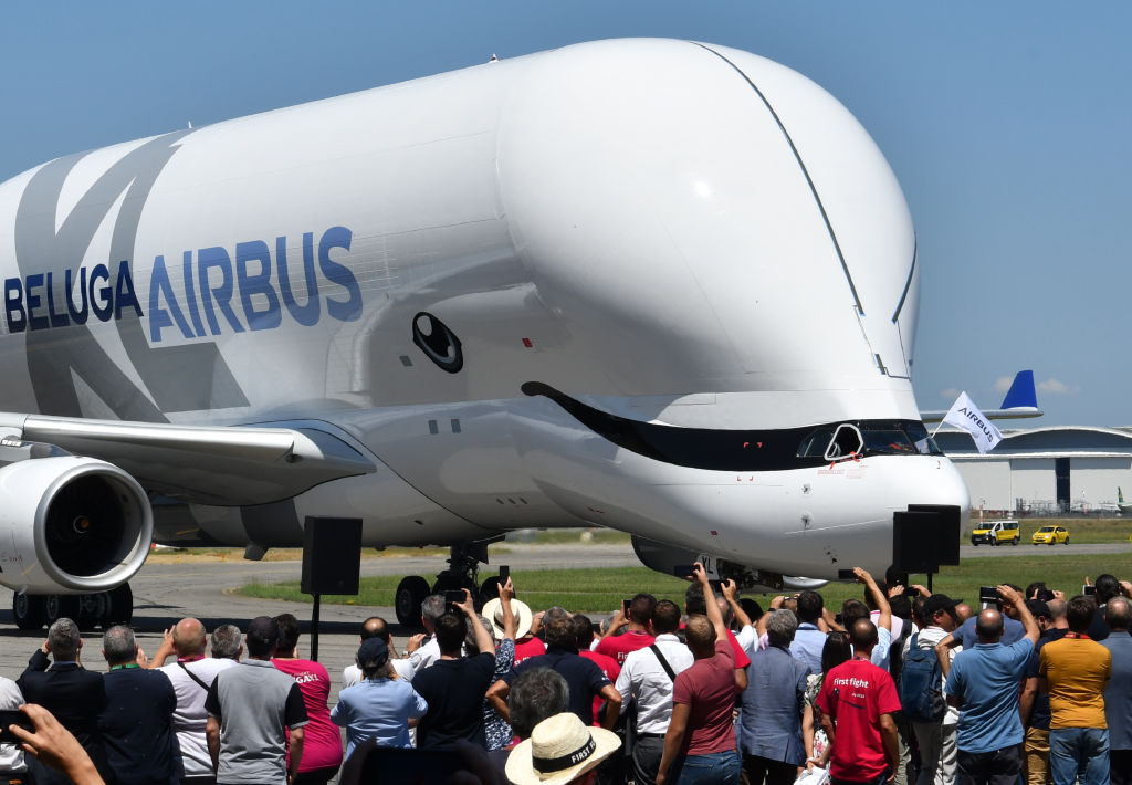 An Airbus 'BelugaXL' aircraft taxis in front of Airbus employees at Toulouse-Blagnac on July 19, 2018 (Photo by ERIC CABANIS / AFP)        