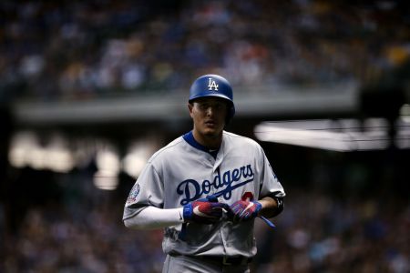 Manny Machado #8 of the Los Angeles Dodgers walks across the field in the seventh inning against the Milwaukee Brewers at Miller Park on July 21, 2018 in Milwaukee, Wisconsin. (Photo by Dylan Buell/Getty Images)