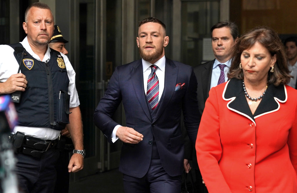 Irish mixed martial arts superstar Conor McGregor (C) arrives to talk to the press after he pleaded guilty to a single violation of disorderly conduct, in Brooklyn Criminal Court on July 26, 2018. (TIMOTHY A. CLARY/AFP/Getty Images)