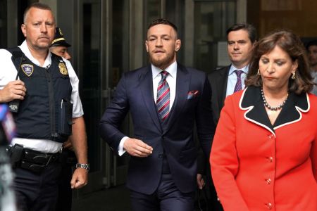Irish mixed martial arts superstar Conor McGregor (C) arrives to talk to the press after he pleaded guilty to a single violation of disorderly conduct, in Brooklyn Criminal Court on July 26, 2018. (TIMOTHY A. CLARY/AFP/Getty Images)