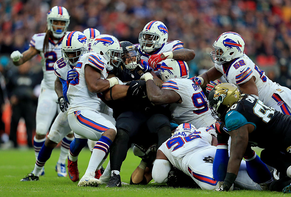 Tyson Alualu #93 of the Jacksonville Jaguars is tackled during the NFL game between Jacksonville Jaguars and Buffalo Bills at Wembley Stadium on October 25, 2015 in London, England. (Photo by Stephen Pond/Getty Images)