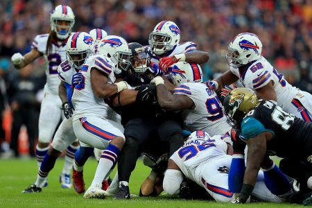 Tyson Alualu #93 of the Jacksonville Jaguars is tackled during the NFL game between Jacksonville Jaguars and Buffalo Bills at Wembley Stadium on October 25, 2015 in London, England. (Photo by Stephen Pond/Getty Images)