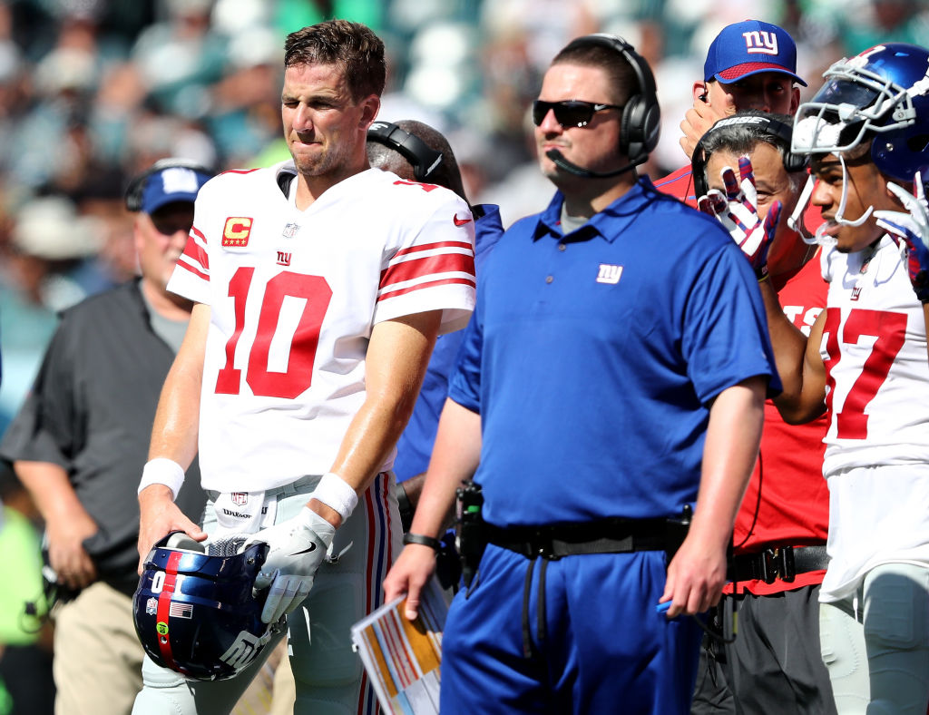 Eli Manning #10 of the New York Giants and head coach Ben McAdoo wait for the review on a touchdown scored in the second quarter by the New York Giants  on September 24, 2017  at Lincoln Financial Field in Philadelphia, Pennsylvania.The touchdown was called back and the New York Giants did not score on the possession against the Philadelphia Eagles.  (Photo by Elsa/Getty Images)