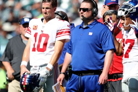 Eli Manning #10 of the New York Giants and head coach Ben McAdoo wait for the review on a touchdown scored in the second quarter by the New York Giants  on September 24, 2017  at Lincoln Financial Field in Philadelphia, Pennsylvania.The touchdown was called back and the New York Giants did not score on the possession against the Philadelphia Eagles.  (Photo by Elsa/Getty Images)