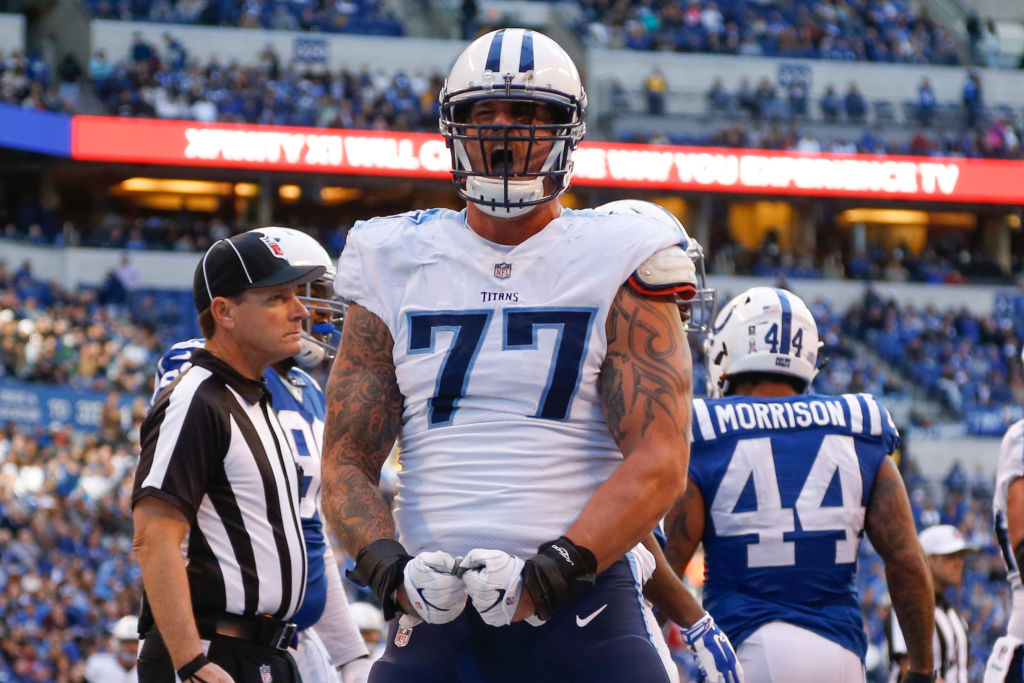 Taylor Lewan #77 of the Tennessee Titans celebrates after a touchdown against the Indianapolis Colts at Lucas Oil Stadium on November 26, 2017 in Indianapolis, Indiana.  (Photo by Michael Reaves/Getty Images)