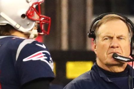 Head Coach Bill Belichick looks on as Tom Brady #12 of the New England Patriots walks by during the AFC Championship Game against the Jacksonville Jaguars at Gillette Stadium on January 21, 2018 in Foxborough, Massachusetts.  (Photo by Adam Glanzman/Getty Images)