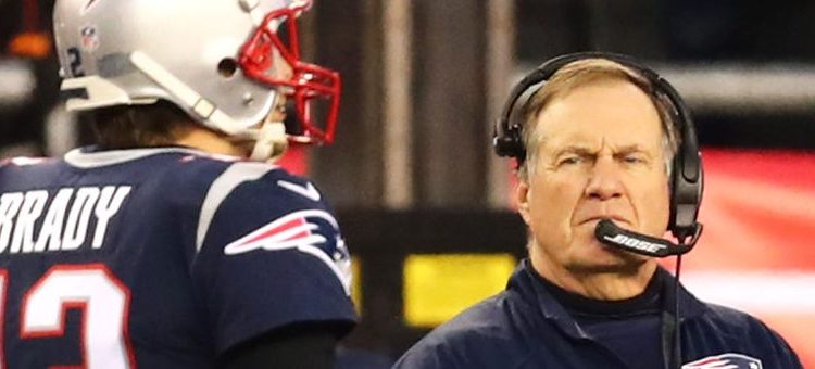 Head Coach Bill Belichick looks on as Tom Brady #12 of the New England Patriots walks by during the AFC Championship Game against the Jacksonville Jaguars at Gillette Stadium on January 21, 2018 in Foxborough, Massachusetts.  (Photo by Adam Glanzman/Getty Images)