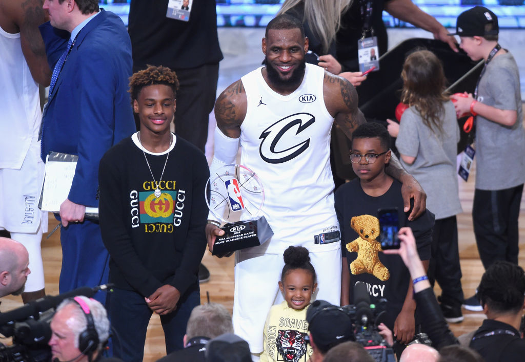 LeBron James Jr., LeBron James #23, Zhuri James and Bryce Maximus James pose for a photo with the All-Star Game MVP trophy during the NBA All-Star Game 2018 at Staples Center on February 18, 2018 in Los Angeles, California.  (Photo by Jayne Kamin-Oncea/Getty Images)