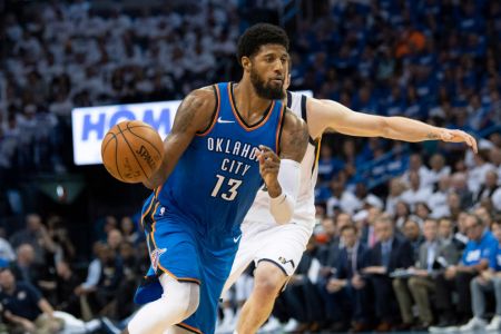 Paul George #13 of the Oklahoma City Thunder brings the ball up court as Joe Ingles #2 of the Utah Jazz applies pressure during game 5 of the Western Conference playoffs at the Chesapeake Energy Arena on April 25, 2018 in Oklahoma City, Oklahoma. (Photo by J Pat Carter/Getty Images)