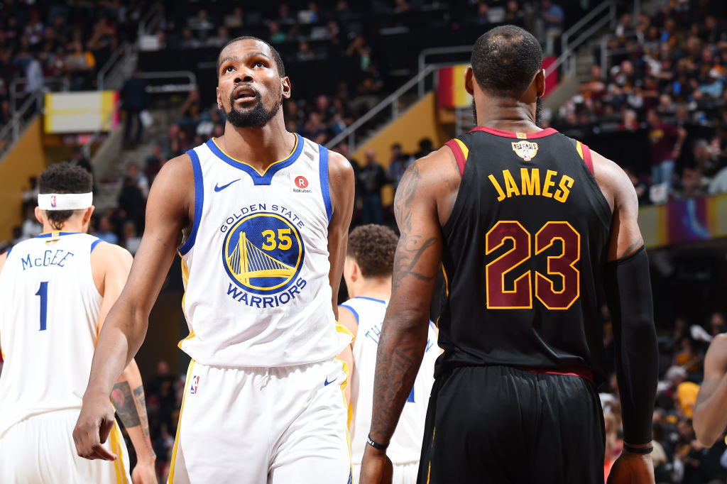 LeBron James #23 of the Cleveland Cavaliers and Kevin Durant #35 of the Golden State Warriors looks on during Game Four of the 2018 NBA Finals on June 8, 2018 at Quicken Loans Arena in Cleveland, Ohio. (Photo by Andrew D. Bernstein/NBAE via Getty Images)