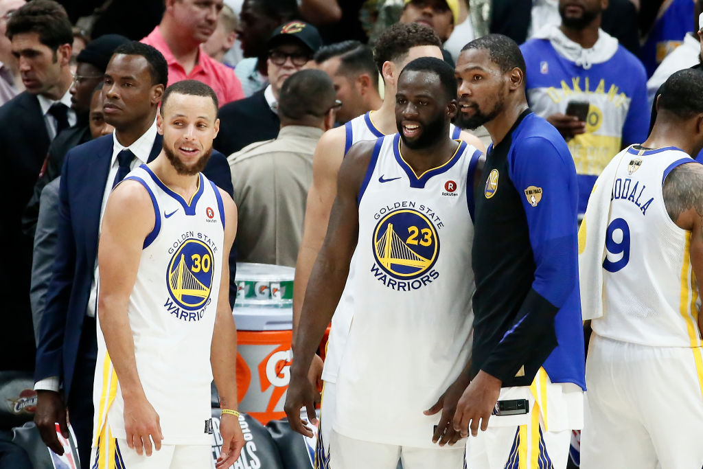 Stephen Curry #30 Draymond Green #23 and Kevin Durant #35 of the Golden State Warriors look on after defeating the Cleveland Cavaliers  in Game Four of the 2018 NBA Finals won 108-85 by the Golden State Warriors over the Cleveland Cavaliers at the Quicken Loans Arena on June 6, 2018 in Cleveland, Ohio. (Photo by Chris Elise/NBAE via Getty Images)