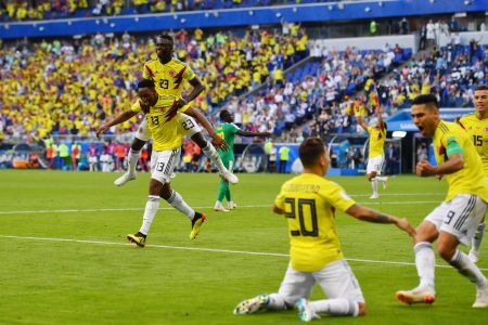 Colombia's defender Yerry Mina (L) celebrates with teammates after scoring a goal during the Russia 2018 World Cup Group H football match between Senegal and Colombia at the Samara Arena in Samara on June 28, 2018. (Photo by Manan VATSYAYANA / AFP/Getty Images)