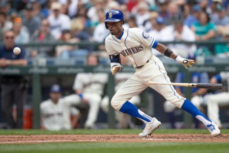 Dee Gordon #9 of the Seattle Mariners lays down a bunt during the sixth inning a game at Safeco Field on July 1, 2018 in Seattle, Washington. The Mariners won the game 1-0. Gordon was thrown out at first base. (Photo by Stephen Brashear/Getty Images)