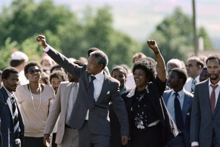 Nelson Mandela and his wife Winnie raise fists upon Mandela's release from Victor Verster prison on February 11, 1990 in Paarl. (ALEXANDER JOE/AFP/Getty Images)