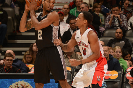 Kawhi Leonard #2 of the San Antonio Spurs handles the ball against DeMar DeRozan #10 of the Toronto Raptors on February 8, 2015 at the Air Canada Centre in Toronto, Ontario, Canada. (Photo by Ron Turenne/NBAE via Getty Images)