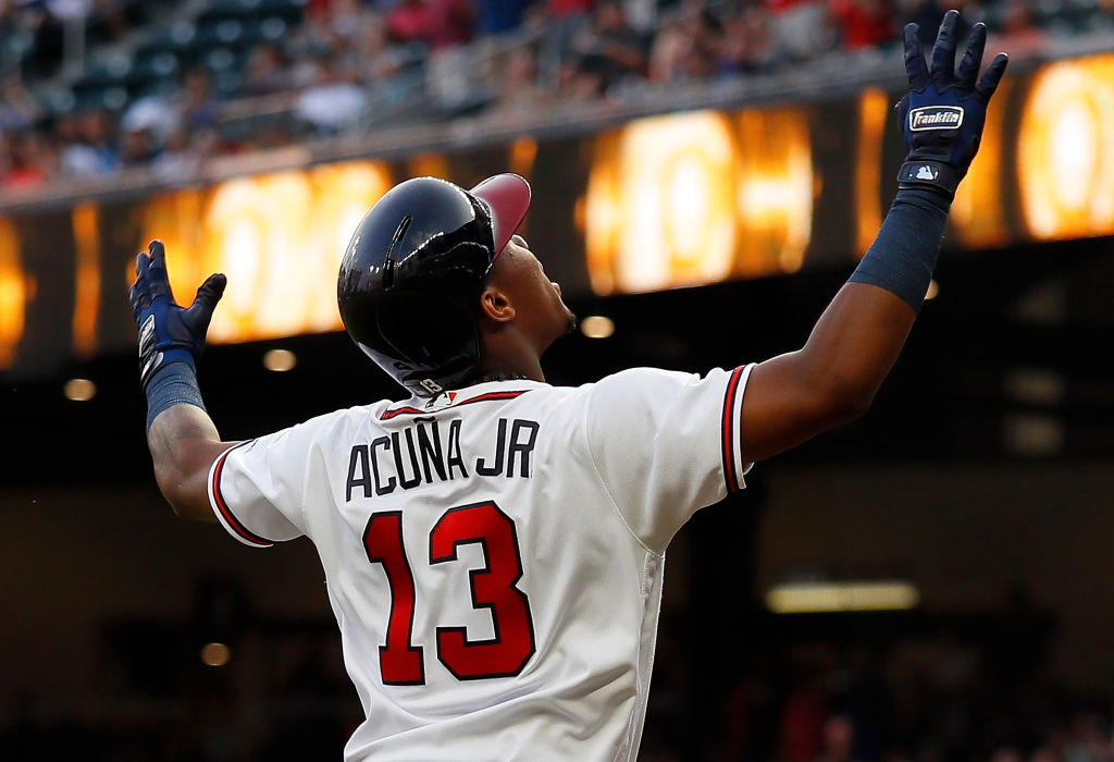 Ronald Acuna Jr. #13 of the Atlanta Braves reacts after hitting a solo homer to lead off game two of a doubleheader against the Miami Marlins at SunTrust Park on August 13, 2018 in Atlanta, Georgia. (Photo by Kevin C. Cox/Getty Images)