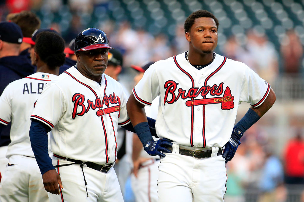 ATLANTA, GA - AUGUST 15: Ronald Acuna Jr. #13 (R) of the Atlanta Braves reacts to being hit by the first pitch of the game against the Miami Marlins at SunTrust Park on August 15, 2018 in Atlanta, Georgia. (Photo by Daniel Shirey/Getty Images)
