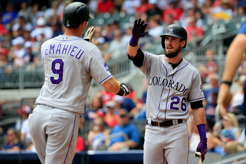 ATLANTA, GA - AUGUST 19: DJ LeMahieu #9 of the Colorado Rockies celebrates a solo home run with David Dahl #26 during the third inning against the Atlanta Braves at SunTrust Park on August 19, 2018 in Atlanta, Georgia. (Photo by Daniel Shirey/Getty Images)