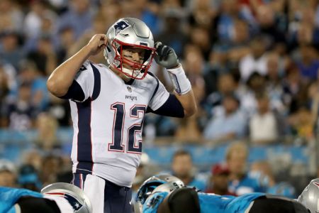 CHARLOTTE, NC - AUGUST 24:  Tom Brady #12 of the New England Patriots makes a call at the line against the Carolina Panthers in the second quarter during their game at Bank of America Stadium on August 24, 2018 in Charlotte, North Carolina.  (Photo by Streeter Lecka/Getty Images)
