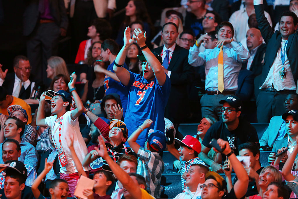 NEW YORK, NY - JUNE 25: Fans cheer after Kristaps Porzingis was selected fourth overall by the New York Knicks in the First Round of the 2015 NBA Draft at the Barclays Center on June 25, 2015 in the Brooklyn borough of  New York City. (Photo by Elsa/Getty Images)