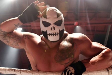 A wrestler who goes by the name Super Beast looks towards a cheering crowd after entering the ring during Hoodslam, an underground professional wrestling event, in Oakland, California on July 7, 2017.   (JOSH EDELSON/AFP/Getty Images)