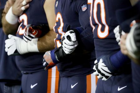 GREEN BAY, WI - SEPTEMBER 28:  Members of the Chicago Bears link arms during the singing of the national anthem before the game against the Green Bay Packers at Lambeau Field on September 28, 2017 in Green Bay, Wisconsin.  (Photo by Jonathan Daniel/Getty Images)