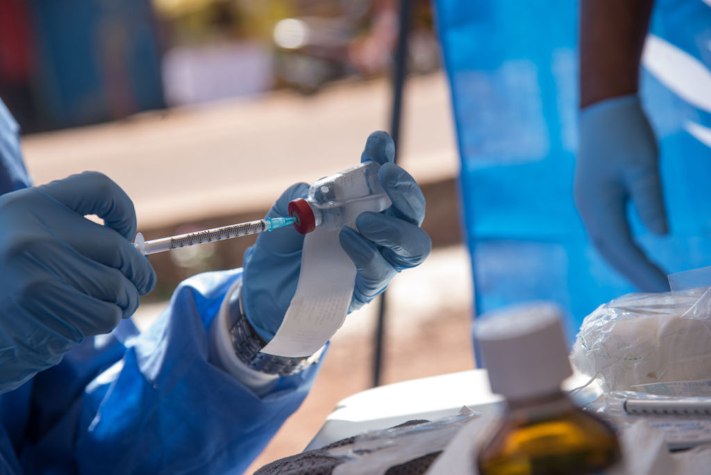 Nurses working with the World Health Organization (WHO) prepare to administer ebola vaccines in the Democratic Republic of Congo (DRC). (Photo by Junior D. KANNAH / AFP/Getty Images)