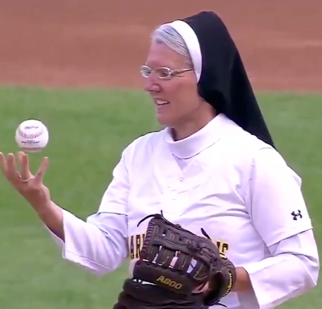 Sister Mary Jo Sobieck doing a trick before tossing out the first pitch. (NBC Sports Chicago/Twitter)